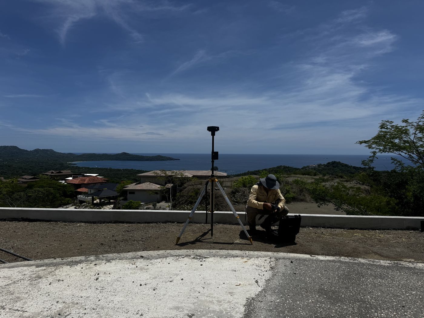Survey setup overlooking coastal properties and the ocean